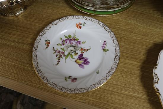 A small collection of decorative floral painted dessert dishes